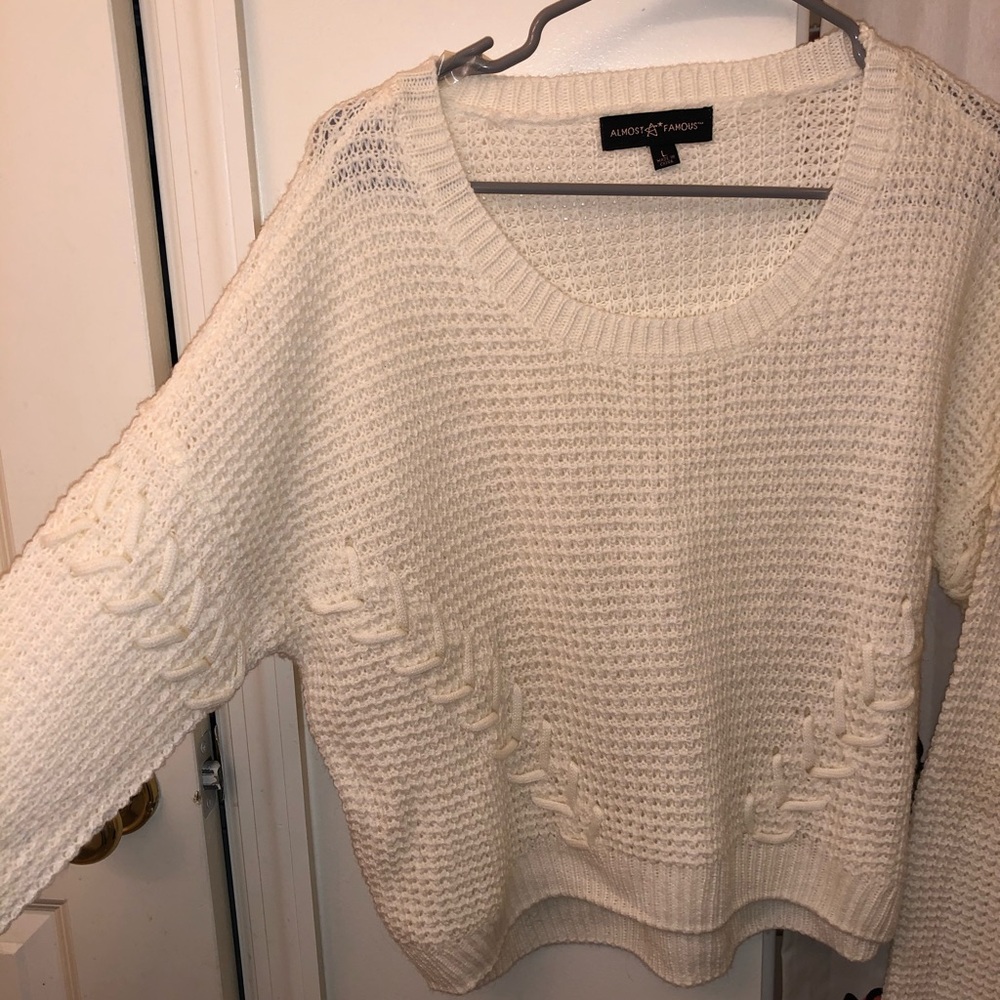 Cream sweater with cross stitch detail